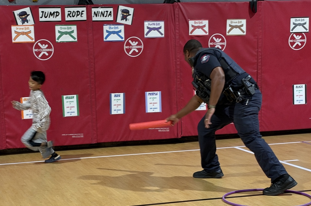 Officer Jennings playing zombie tag in PE