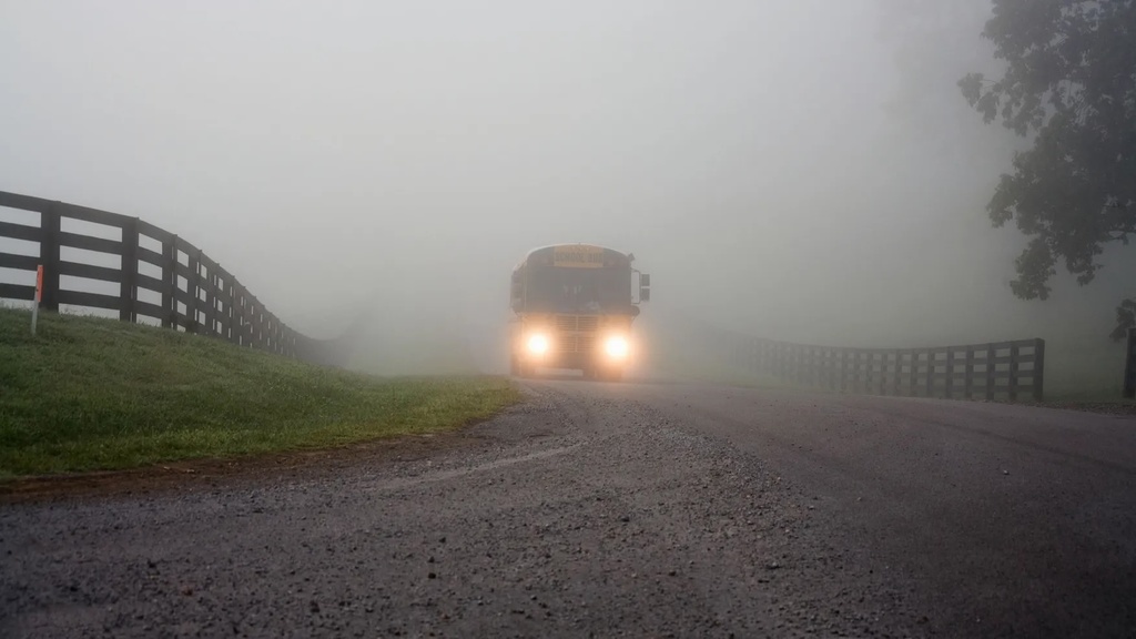 dense fog with school bus