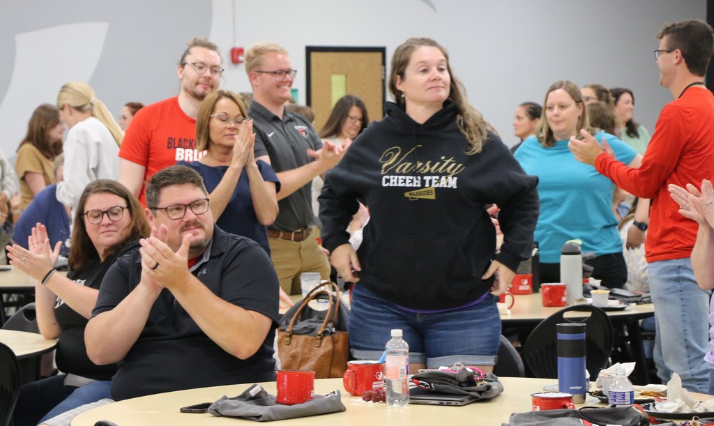Teachers stand as they are welcomed back to BCS for the 25-26 session