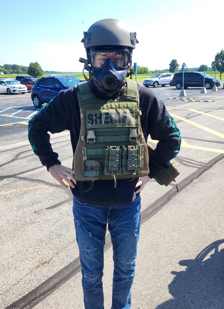 Students in Mrs. Wallace's class learn about Officer Cavanaugh's gear and vehicle.