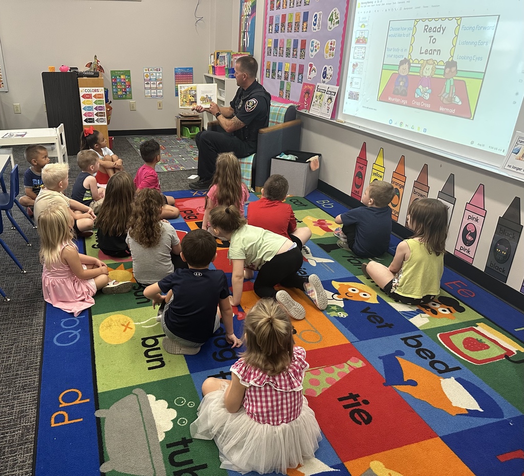 Officer Joel Allred reads to BPS preschoolers