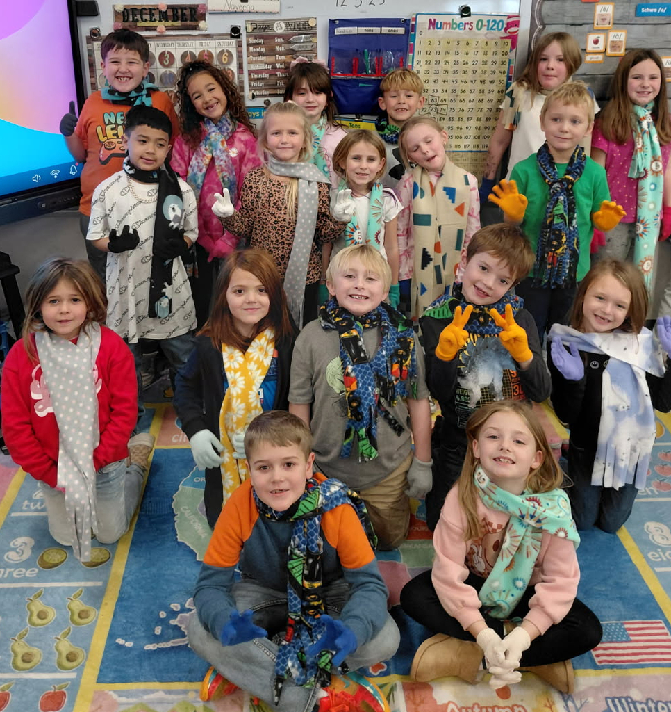 BPS first grade students show off their new scarves and gloves kindly provided by the Montpelier Church of the Nazarene