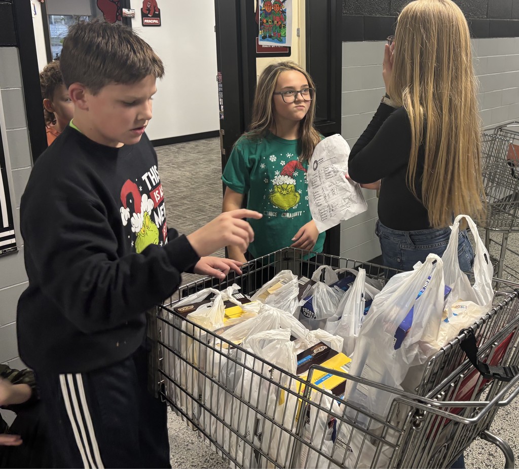 BCS students help distribute donated boxes of cereal to all BCS students