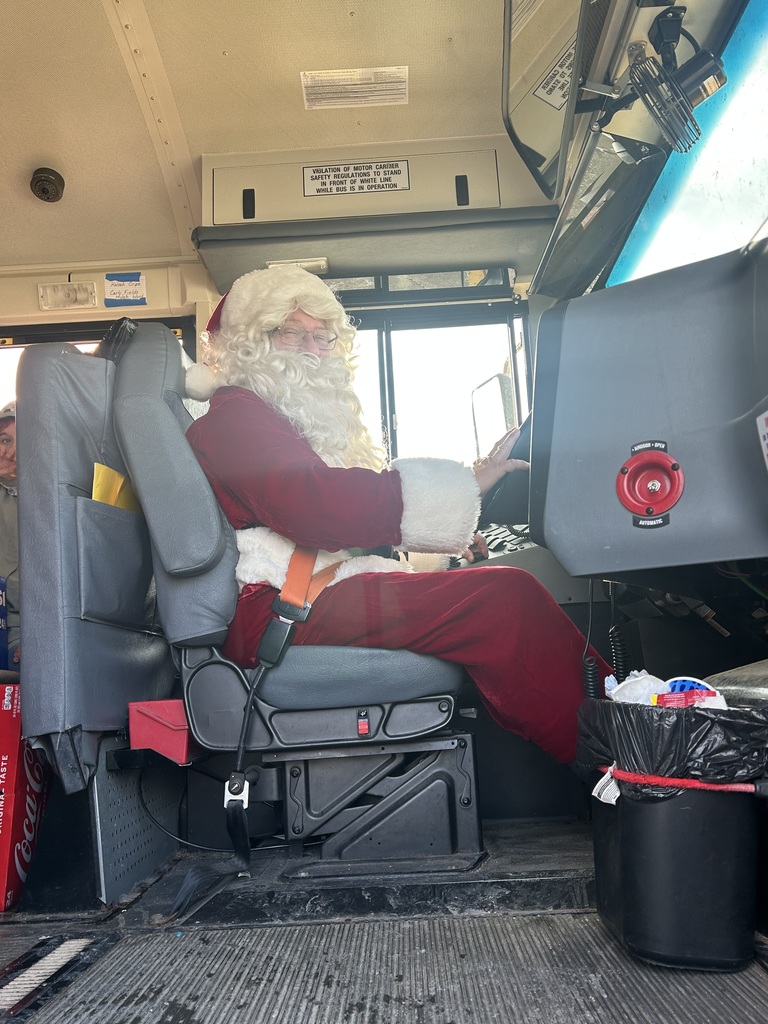 Bus driver Ted Cain dresses up as Santa to deliver his students home