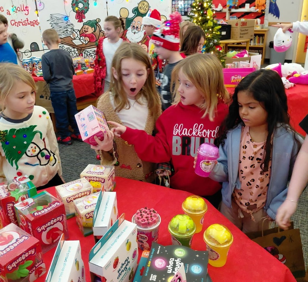 Students select their own presents to give to classmates during the Santa Shop at BPS
