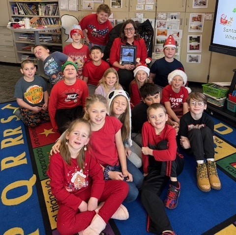 Assistant Superintendent Lesley Moulton reads to elementary students throughout the district