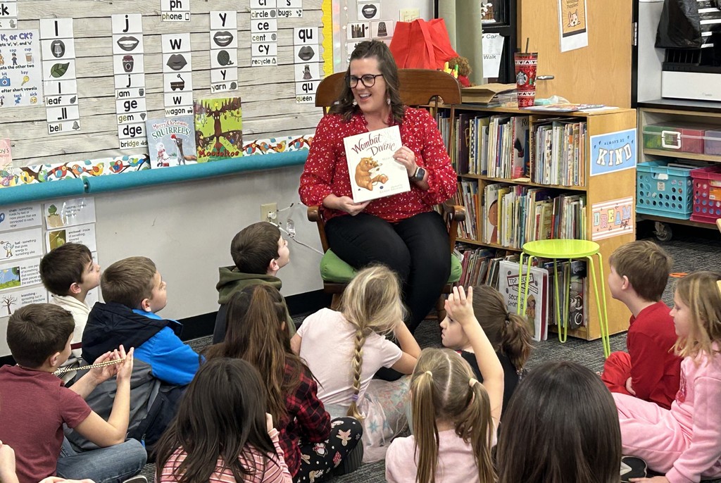 Assistant Superintendent Lesley Moulton reads to elementary students throughout the district