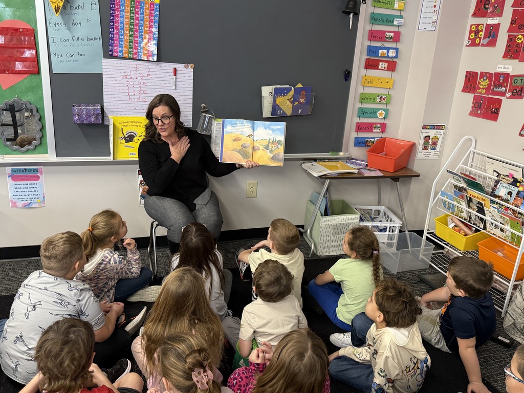 Assistant Superintendent Lesley Moulton reads to elementary students throughout the district