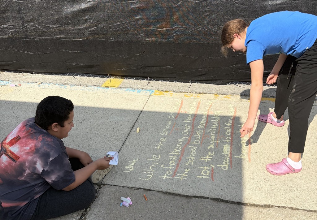 7th grade students do sentence work with sidewalk chalk at BJSHS 