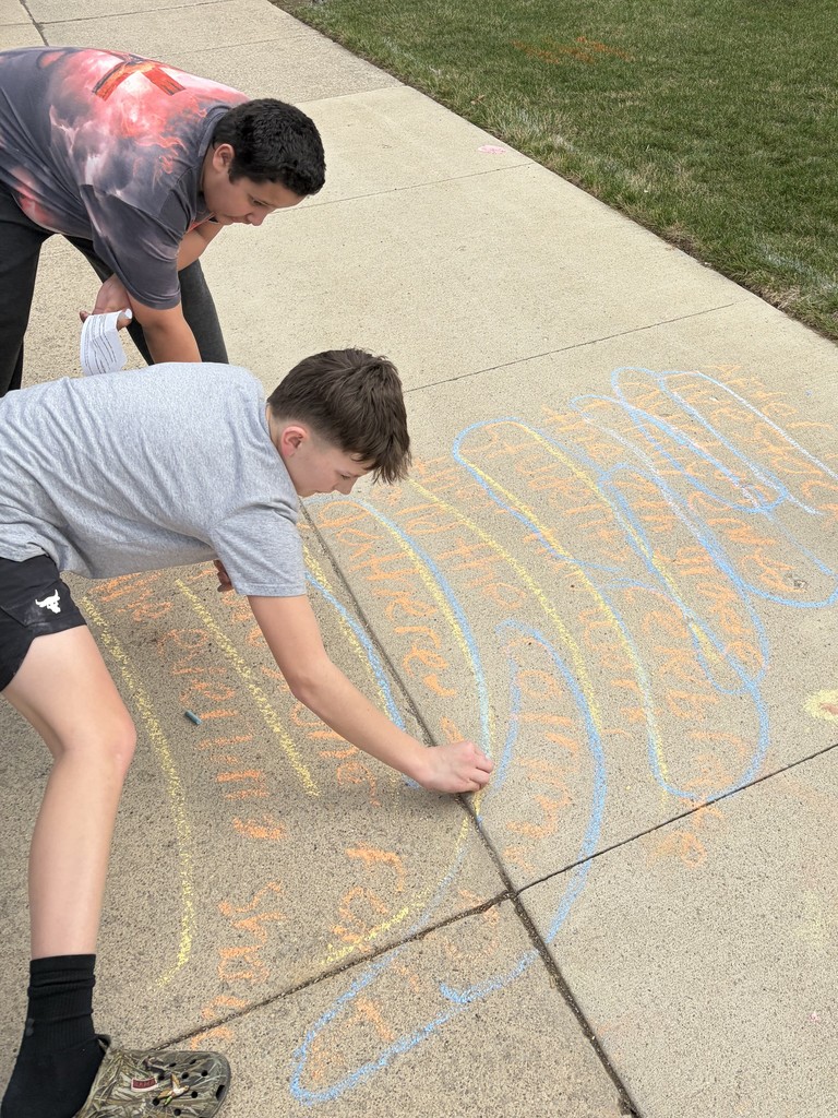 7th grade students do sentence work with sidewalk chalk at BJSHS 
