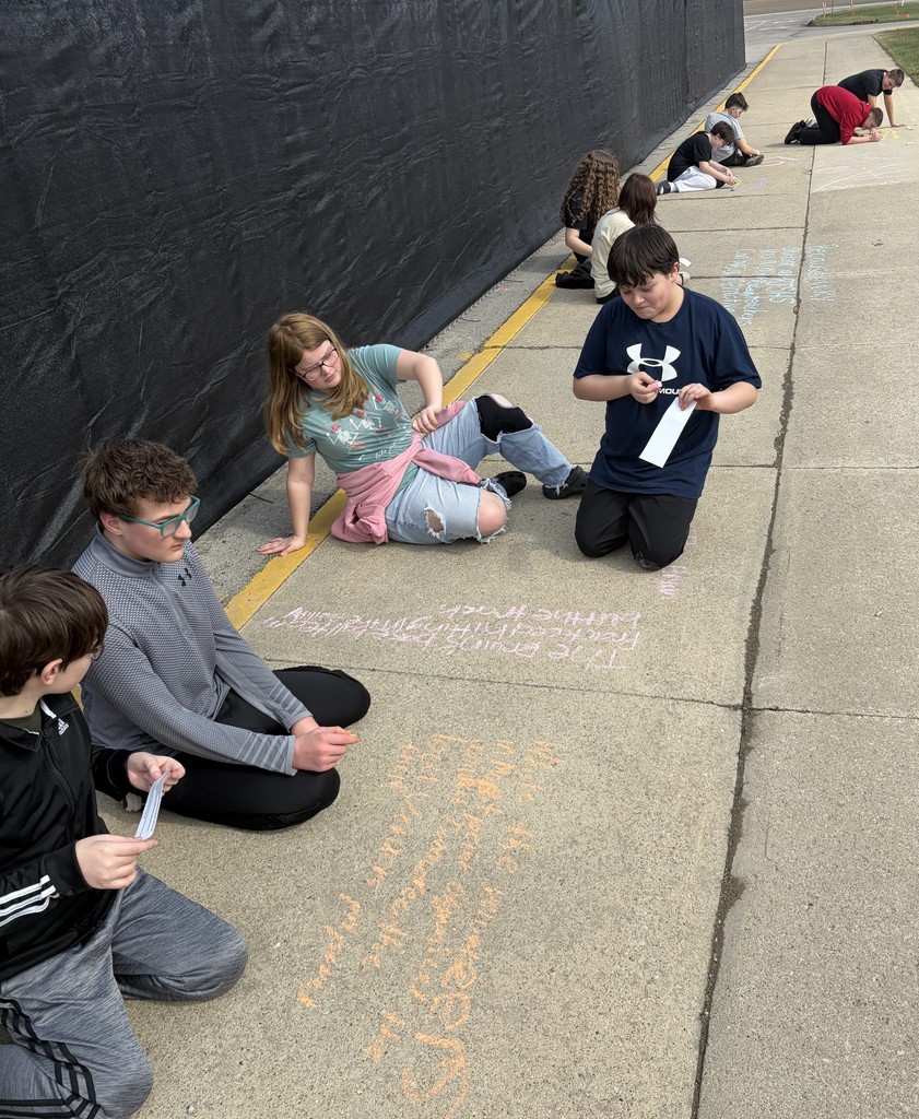 7th grade students do sentence work with sidewalk chalk at BJSHS 