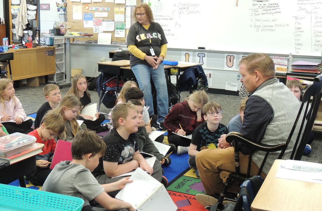 Superintendent Chad Yencer answers questions from Mrs. Carma Reidy's 3rd grade students at BIS