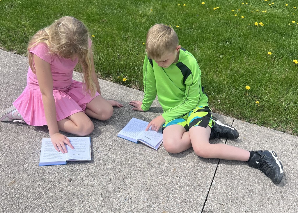 BIS students celebrate the completion of their fundraiser with new books to read!