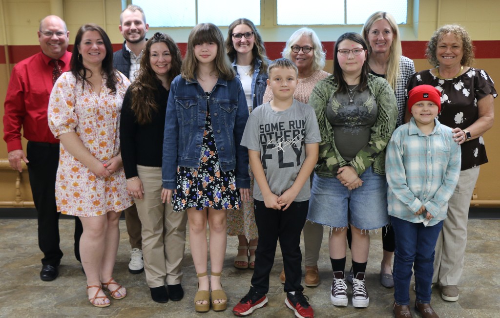 BIS Most Improved Students, their teachers and principals include:  (front row l-r) Katherine Farmer, Jessica Dunica, 5th grader Olivia Adams, 4th grader Bentley Burns, 6th grader Natalie Carnes, 3rd grader Anastasia Boyd, Row 2- Principal Jim Fox, Assistant Principal Chas Gabriel, Katie Barnes, Beth Wall, Lyndesy Ahern and Carma Reidy