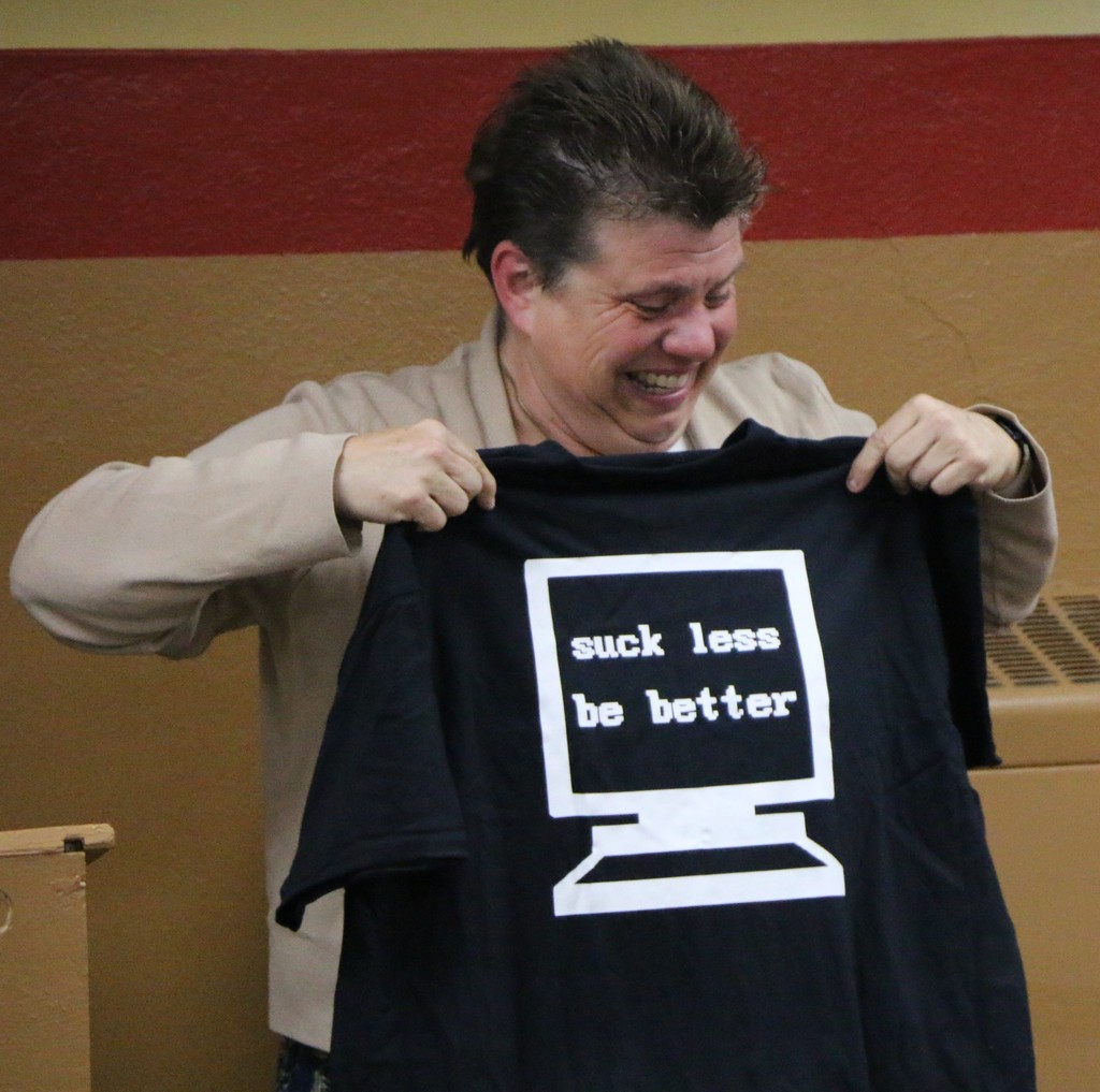Mrs. Jennifer Gallatin laughs as she holds up the shirt she received from BJSHS senior Zayne Rodarmel during the Jennerjahn Most Influential Educator Awards