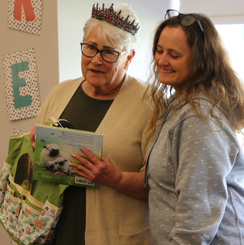 Julia Tucker was a presented a crown and a bag full of books from colleague Amber Crabtree during her BPS Teacher of the Year  reception