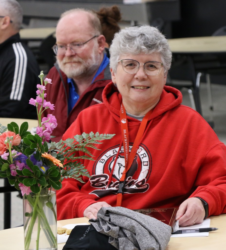 2026 BJSHS Teacher of the Year Linda Wallace who is joined in the background by her husband Tim Wallace