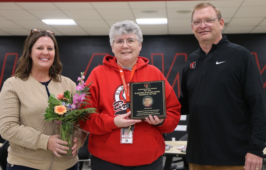 2026 BJSHS Teacher of the Year Linda Wallace who is joined by Assistant Superintendent Lesley Moulton and Superintendent Chad Yencer