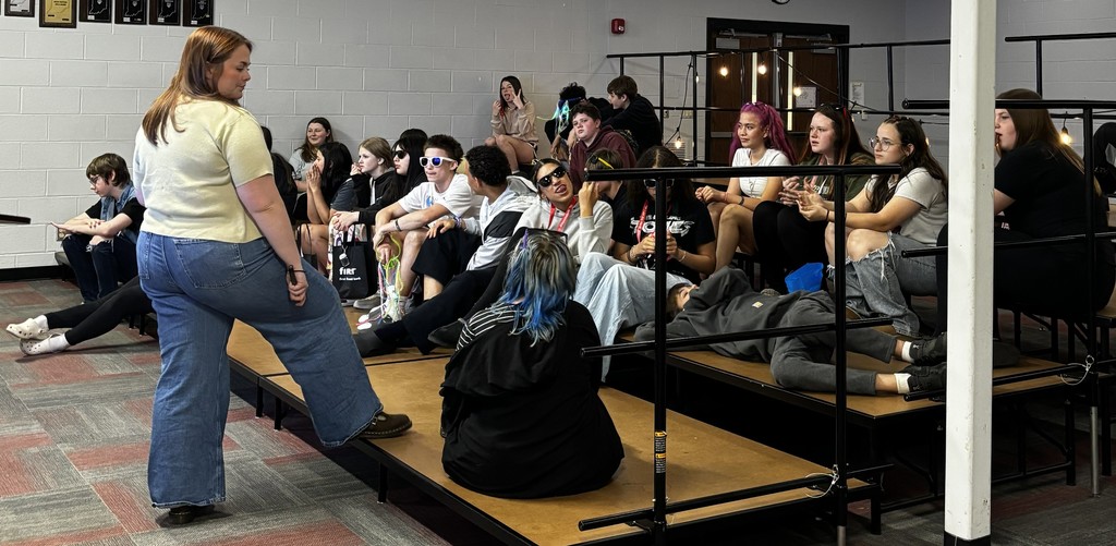 BJSHS 7th or 8th grade students gather with their teacher to play a singing game