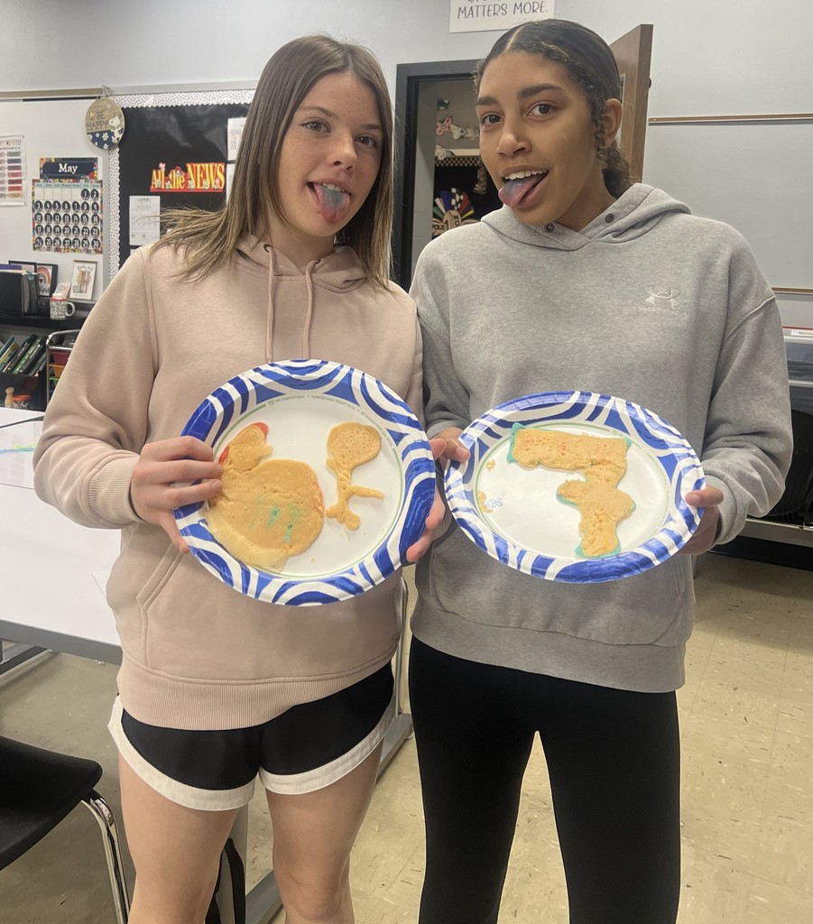 BJSHS 7th or 8th grade girls show their pancake art in the shape of a heart