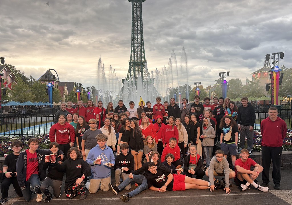 BJSHS 7th grade poses before the Eifel Tower and fountains at King's Island