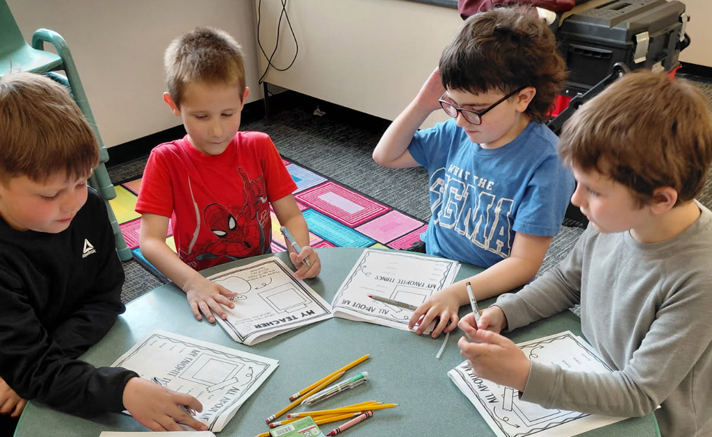 4 BPS 2nd graders sit in a circle and work on Memory Books during their PTO-sponsored Fun Day!