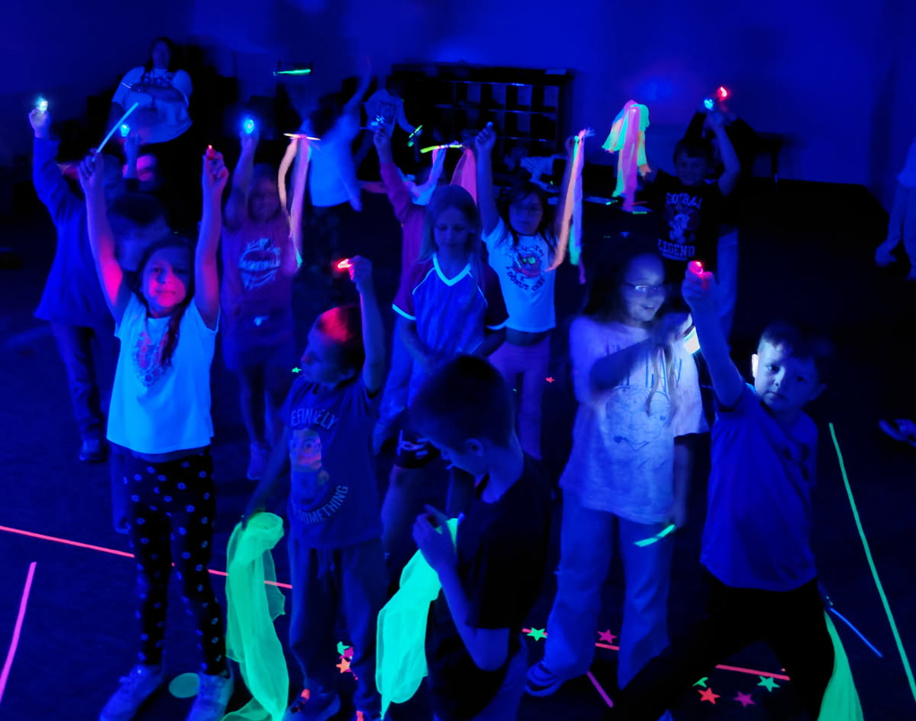 BPS 2nd graders play in the Glow Room during the PTO-sponsored Fun Day