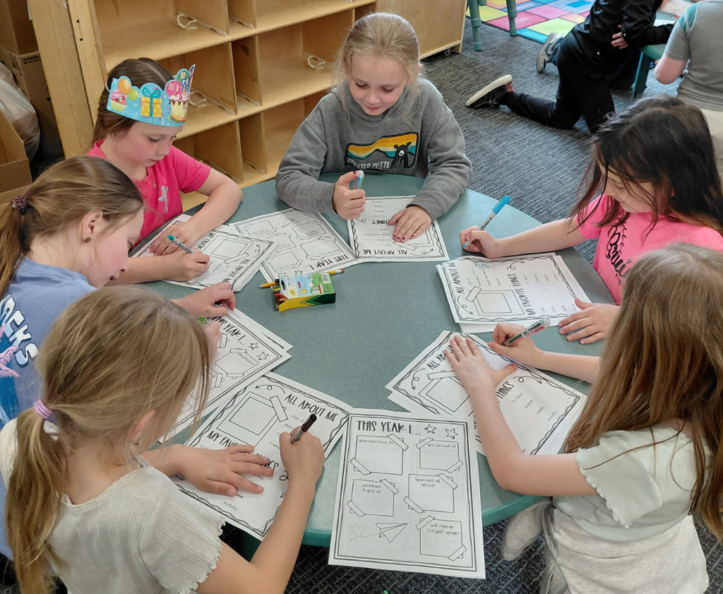6 BPS 2nd graders sit in a circle and work on Memory Books during their PTO-sponsored Fun Day!