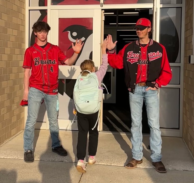 Members of the BJSHS Baseball Team greet the BPS Cubs on their way into school