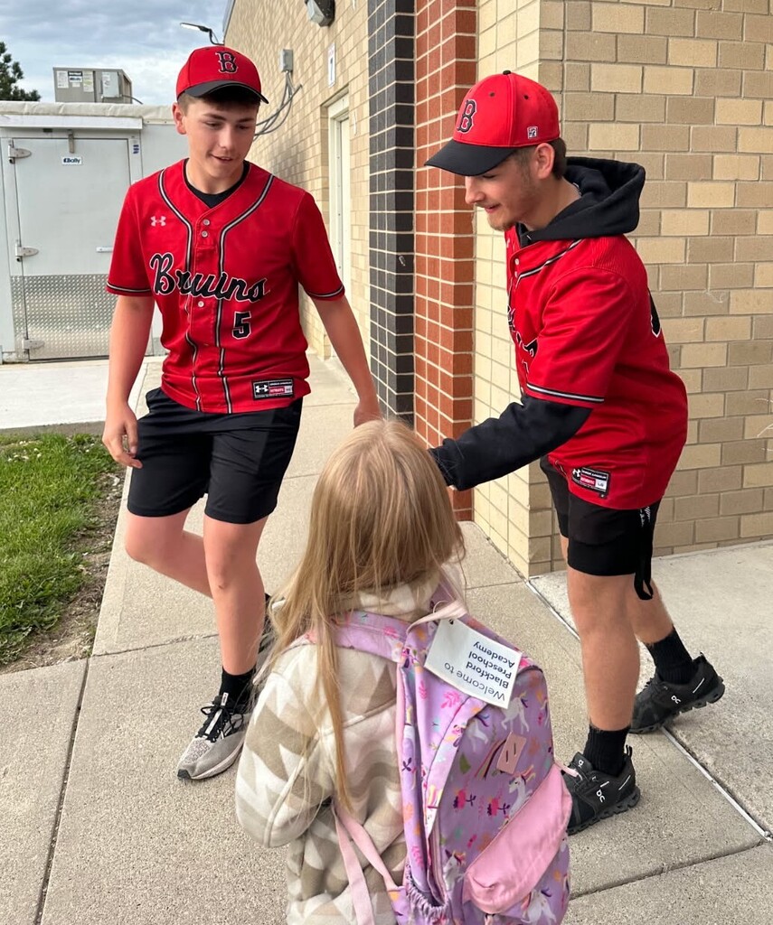 Members of the BJSHS Baseball Team greet the BPS Cubs on their way into school