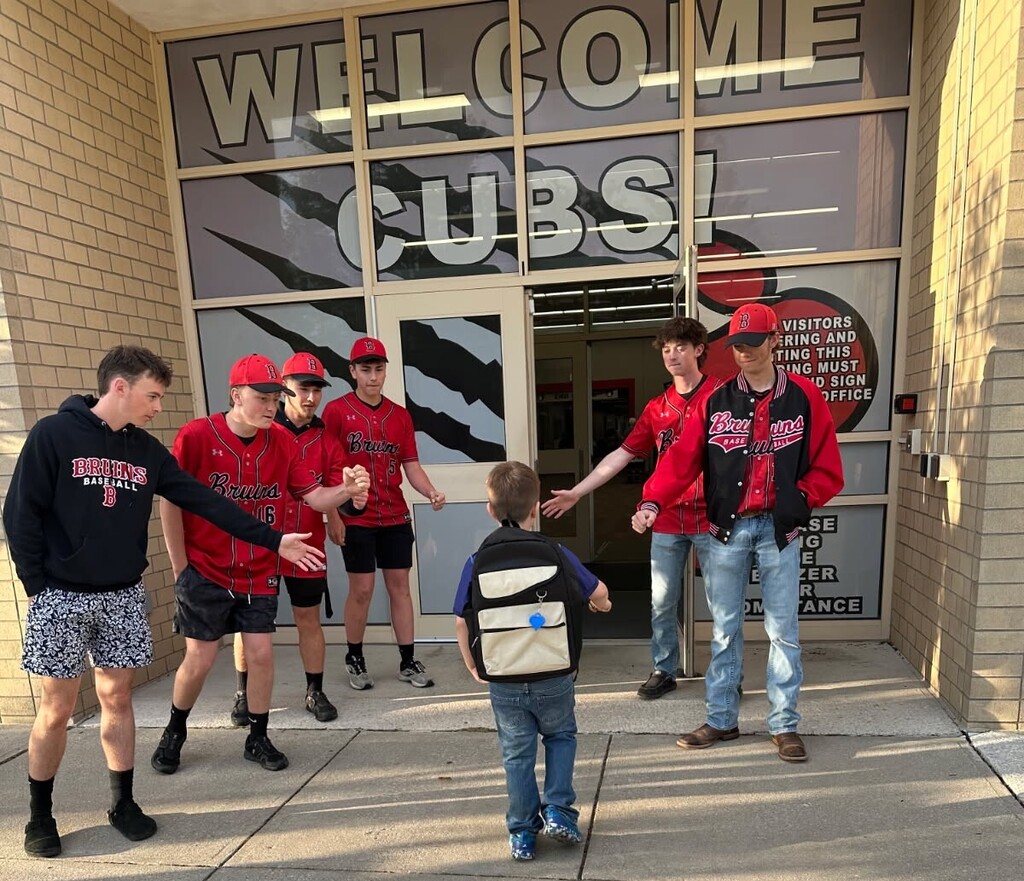 Members of the BJSHS Baseball Team greet the BPS Cubs on their way into school