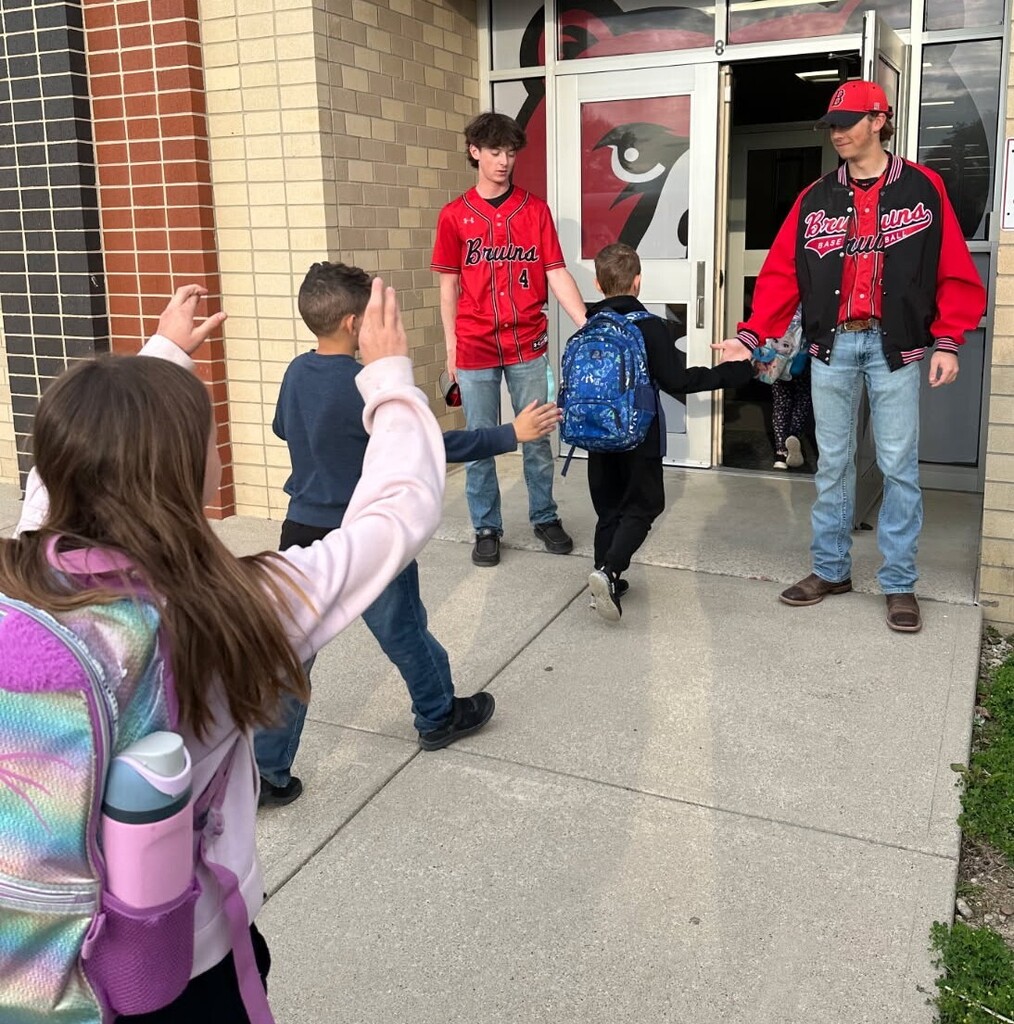Members of the BJSHS Baseball Team greet the BPS Cubs on their way into school
