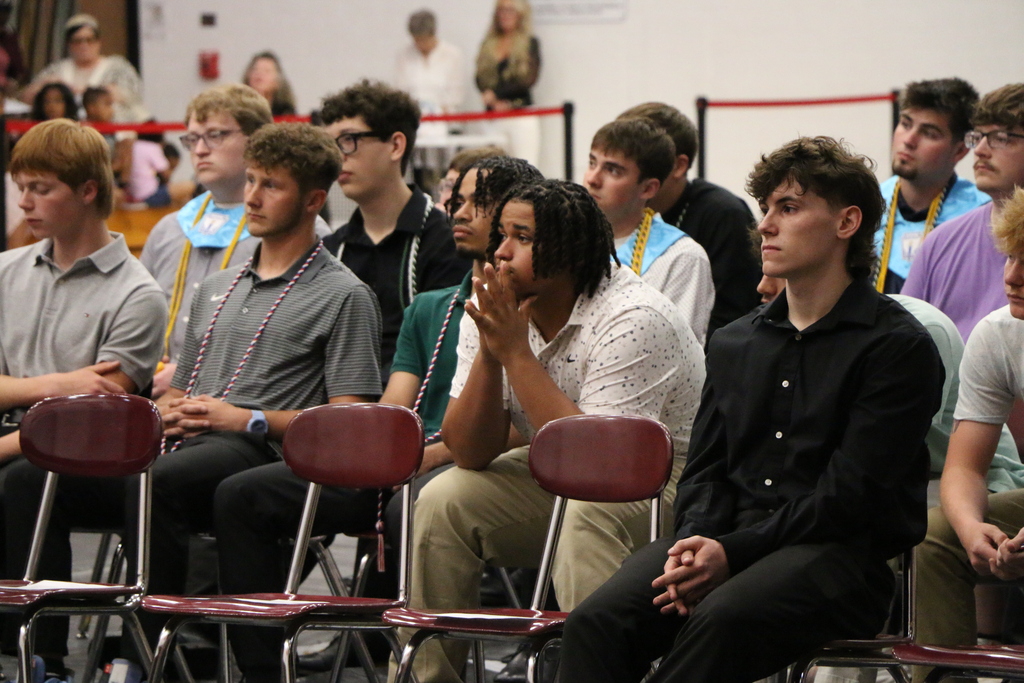 As his fellow students look on, Sean Cronin III accepts the first Gavyn Orlando Memorial Scholarship from the Gavyn Orlando family during the BJSHS Senior Awards 