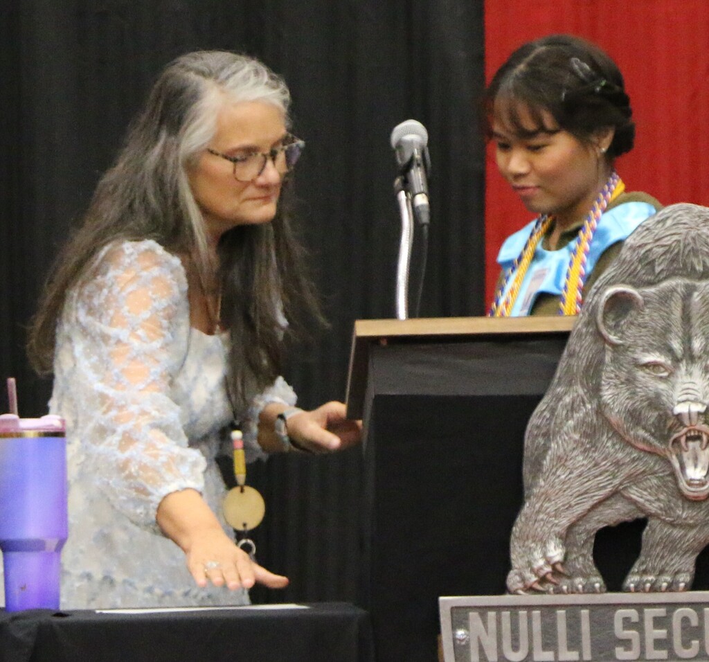 Mrs. Carrie Clevenger presents a Certificate of Multilingual Proficiency to BJSHS senior Jan Mae Batilo