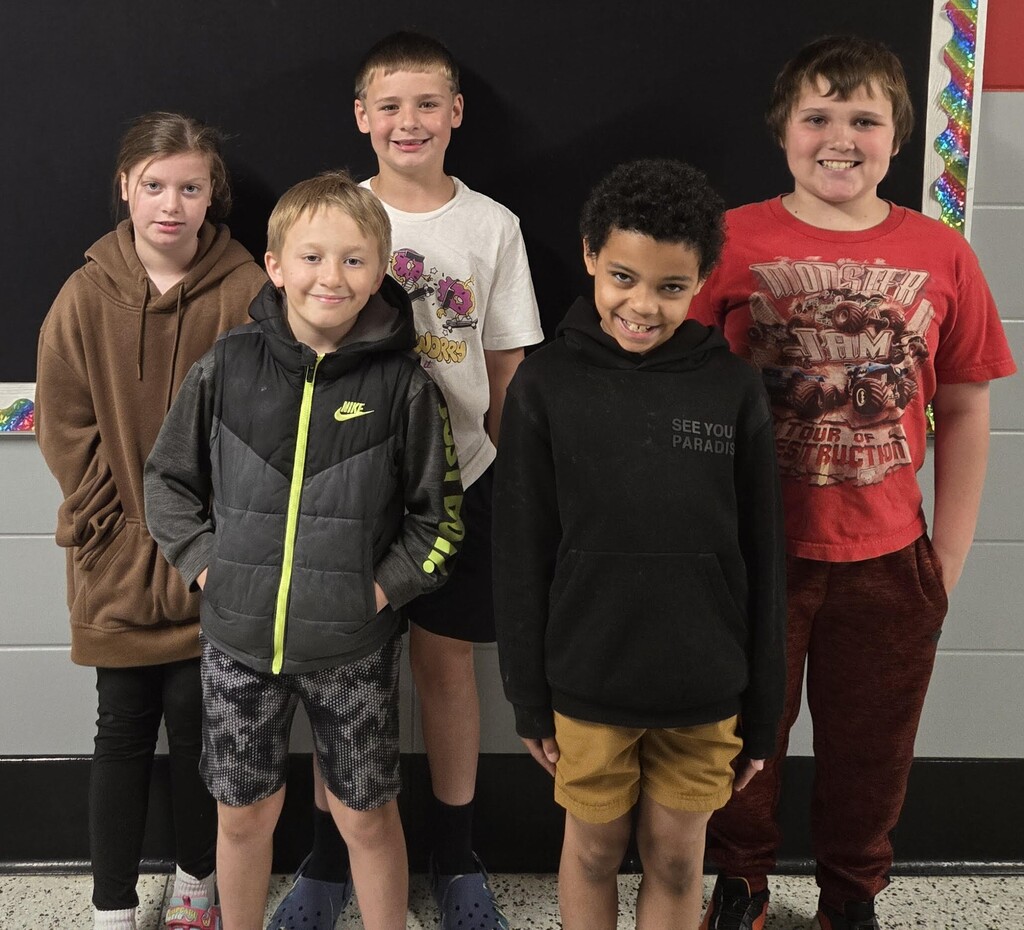 4 boys and 1 girl from the BIS 4th grade stand as the 2nd place winners of the race car contest.