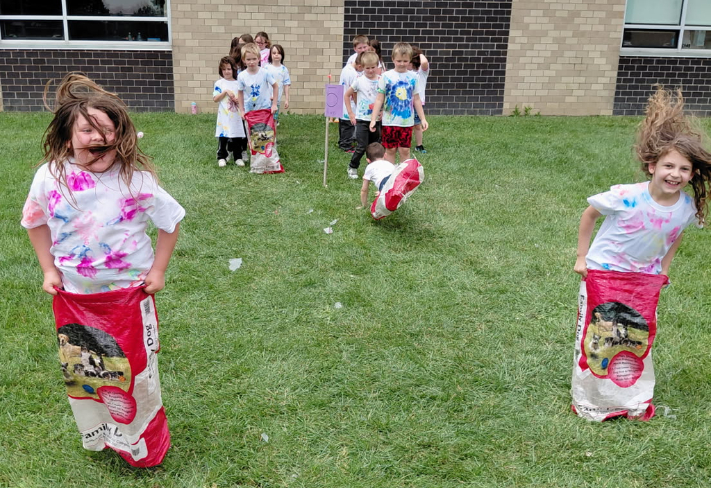 BPS students participate in a sack race during the BPS End of School Field Day