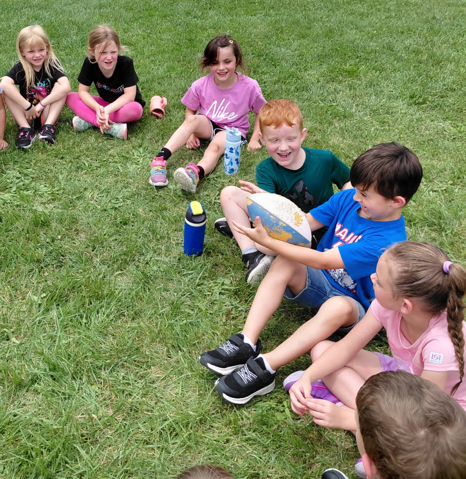BPS students play a football game during the End of School Year Field Day