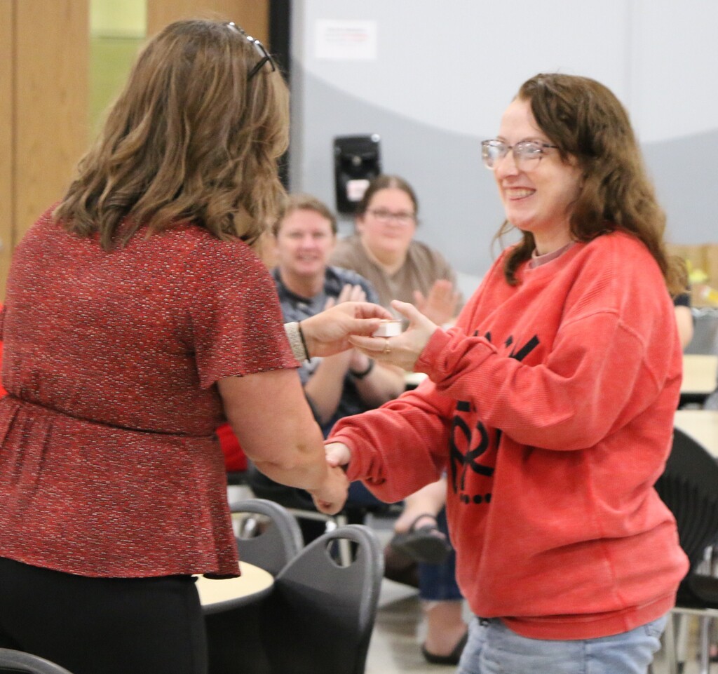 BIS Elementary teacher Victoria Mattucci  receives her service pin from Assistant Superintendent Lesley Moulson