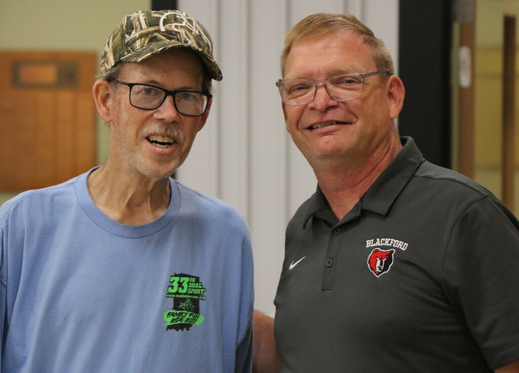 Dave Smith is honored for his service to BCS by (right) Superintendent Chad Yencer 