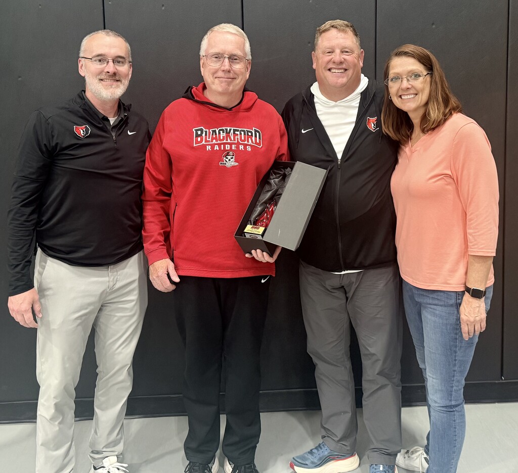 BJSHS JROTC Instructor Major Tim Cummins is congratulated on his retirement from BCS by (left) Principal Jason Ridge, Master Sargent Rick Kauffman, and Assistant Principal Karen Mealy
