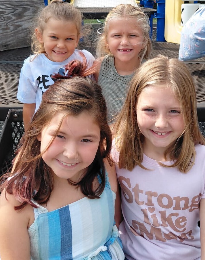 4 BPS girls pose for a photo at recess
