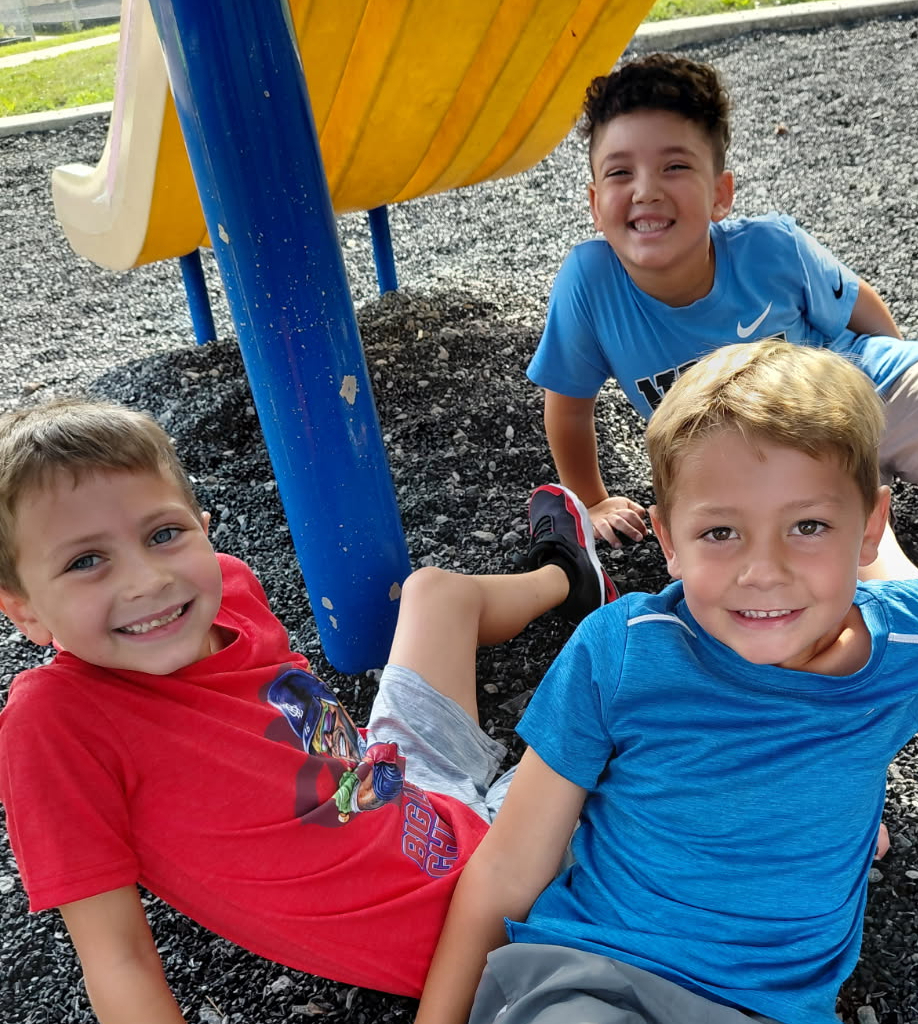 BPS boys pose for a photo at recess