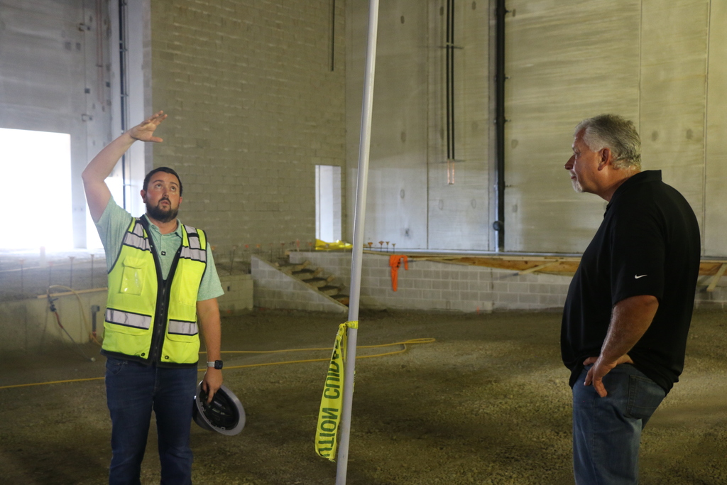 Meyer Najem Site Manager Kyle Jones and BCS Board President Phil Jones look over the construction of the BJSHS Performing Arts Center