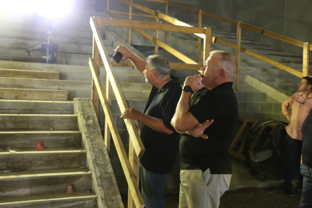 School Board members Phil Jones and Scott Malott check out the seating in the BJSHS Performing Arts Center
