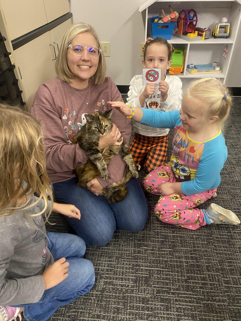 Students with Mrs. Shalee Myron and her cat June