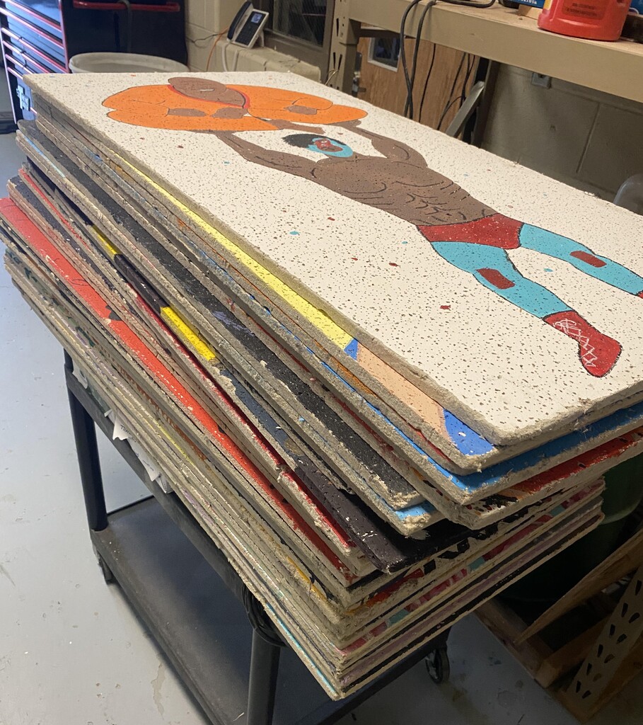 A stack of decorated ceiling tiles