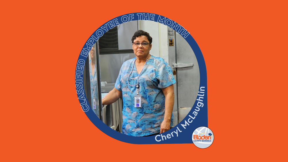 Graphic announcing Classified Employee of the Month featuring Cheryl McLaughlin, standing in a school kitchen beside industrial food service equipment, wearing a blue patterned uniform and ID badge, with Bladen County Schools logo.