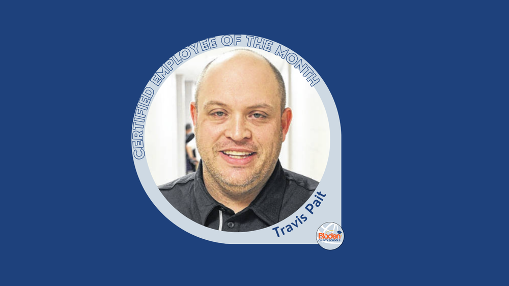 **Alt text:** Portrait of Travis Pait, Certified Employee of the Month, smiling in a dark collared shirt, standing in a school hallway, displayed within a Bladen County Schools recognition graphic.