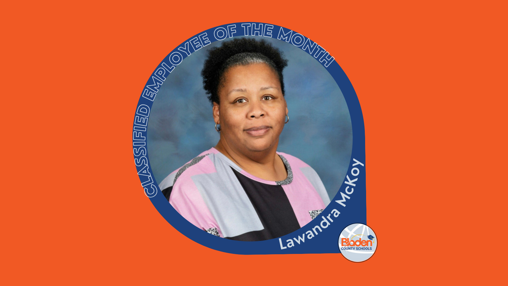 Graphic announcing Classified Employee of the Month featuring Lawandra McKoy, smiling in a professional portrait against a blue backdrop, wearing a pink, gray, and black top, with Bladen County Schools logo.