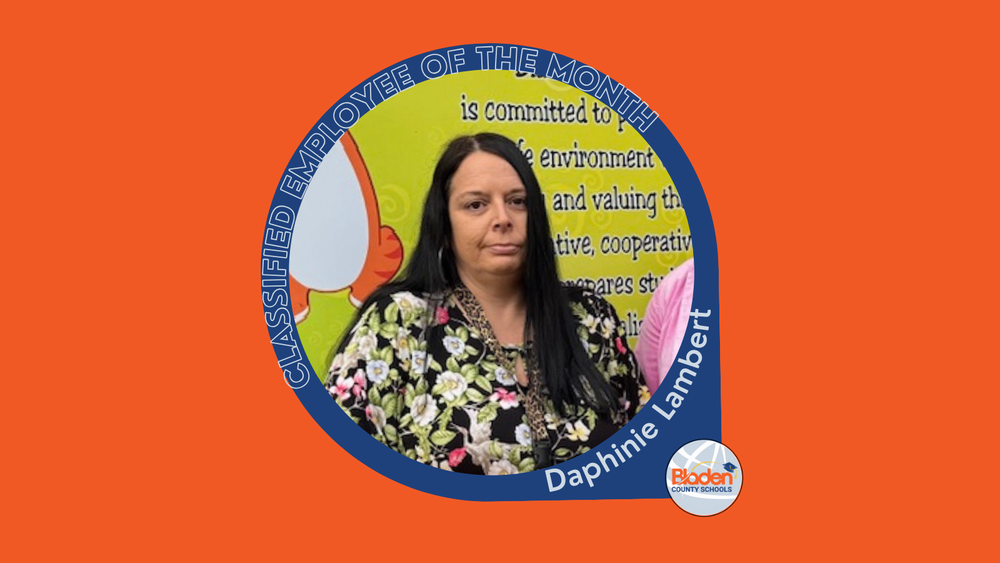 Graphic announcing Classified Employee of the Month featuring Daphine Lambert, wearing a floral blouse, standing in front of a school display, with Bladen County Schools logo.